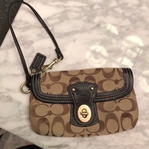 Brown and tan coach wristlet
